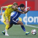 Sweden's Therese Sjogran (15) and United States' Sydney Leroux chase down the ball during first-half FIFA Women's World Cup soccer game action in Winnipeg, Manitoba, Canada, Friday, June 12, 2015. 
