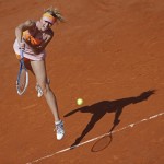 Russia's Maria Sharapova returns the ball during final of the French Open tennis tournament against Romania's Simona Halep at the Roland Garros stadium, in Paris, France, Saturday, June 7, 2014. (AP Photo/David Vincent)