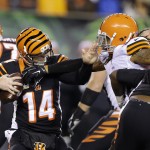  Cincinnati Bengals quarterback Andy Dalton (14) is pressured by Cleveland Browns outside linebacker Jabaal Sheard during the first half of an NFL football game Thursday, Nov. 6, 2014, in Cincinnati. (AP Photo/Michael Conroy)