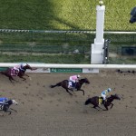 Victor Espinoza rides American Pharoah to victory in the 141st running of the Kentucky Derby horse race at Churchill Downs Saturday, May 2, 2015, in Louisville, Ky. (AP Photo/Charlie Riedel)
