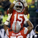 Ohio State's Ezekiel Elliott (15) celebrates after a nine-yard touchdown run during the second half of the NCAA college football playoff championship game against Oregon Monday, Jan. 12, 2015, in Arlington, Texas. (AP Photo/LM Otero)
