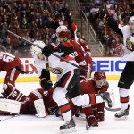 Ottawa Senators' Milan Michalek (9), of the Czech Republic, celebrates his goal against the Arizona Coyotes as teammate Alex Chiasson, right, celebrates while Coyotes' Connor Murphy (5) kneels on the ice during the first period of an NHL hockey game Saturday, Jan. 10, 2015, in Glendale, Ariz. (AP Photo/Ross D. Franklin)