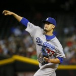 Los Angeles Dodgers starting pitcher Carlos Frias (77) throws against the Arizona Diamondbacks during the first inning of a baseball game, Tuesday, June 30, 2015, in Phoenix. (AP Photo/Matt York)