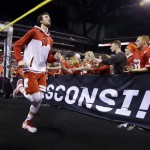 Wisconsin's Frank Kaminsky runs to the court before the NCAA Final Four college basketball tournament championship game between Wisconsin and Duke Monday, April 6, 2015, in Indianapolis. (AP Photo/Michael Conroy)