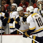 Nashville Predators left wing James Neal (18) celebrates with teammates after scoring his first goal during the first period in Game 6 of an NHL Western Conference hockey playoff series against the Chicago Blackhawks, Saturday, April 25, 2015, in Chicago. (AP Photo/Nam Y. Huh)