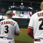Arizona Diamondbacks' Kirk Gibson (23), Alan Trammell (3) and Dave McKay (39) pause for a moment of silence for Tony Gwynn, the Hall of Fame baseball player, who passed away at age 54 prior to a baseball game against the Milwaukee Brewers on Monday, June 16, 2014, in Phoenix. (AP Photo/Ross D. Franklin)