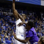 Kentucky's Alex Poythress, left, is fouled by Grand Canyon's Kerwin Smith during the first half of an NCAA college basketball game, Friday, Nov. 14, 2014, in Lexington, Ky. (AP Photo/James Crisp)