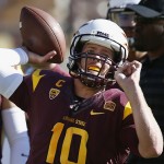 Arizona State's Taylor Kelly throws a pass as he warms up prior to an NCAA college football game agianst Washington State, Saturday, Nov. 22, 2014, in Tempe, Ariz. (AP Photo/Ross D. Franklin)