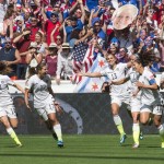 United States teammates, from left to right, Morgan Brian (14), Tobin Heath (17), Alex Morgan (13), Lauren Holiday (12), Carli Lloyd (10) and Ali Krieger (11) celebrate after Lloyd's second goal against Japan during the first half of the FIFA Women's World Cup soccer championship in Vancouver, British Columbia, Canada, on Sunday, July 5, 2015. (Jonathan Hayward/The Canadian Press via AP) 