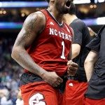 North Carolina State's Trevor Lacey (1) celebrates as he leaves the court with his team leading No. 1 seed Villanova at the end of the first half of an NCAA tournament third-round college basketball game, Saturday, March 21, 2015, in Pittsburgh. (AP Photo/Gene J. Puskar)