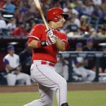 Los Angeles Angels' Efren Navarro follows through with a two-run single against the Arizona Diamondbacks during the sixth inning of a baseball game, Thursday, June 18, 2015, in Phoenix. (AP Photo/Ross D. Franklin)