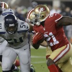 San Francisco 49ers running back Frank Gore (21) runs against Seattle Seahawks middle linebacker Bobby Wagner (54) during the first quarter of an NFL football game in Santa Clara, Calif., Thursday, Nov. 27, 2014. (AP Photo/Jeff Chiu)