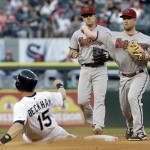  Arizona Diamondbacks second baseman Aaron Hill, right, throws out Chicago White Sox's Marcus Semien at first base after forcing out Gordon Beckham (15) at second base during the fourth inning of an interleague baseball game in Chicago, Saturday, May 10, 2014. (AP Photo/Nam Y. Huh)
