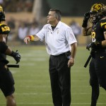Arizona State coach Todd Graham talks to his players during the second half of an NCAA college football game against UCLA, Thursday, Sept. 25, 2014, in Tempe, Ariz. (AP Photo/Matt York)