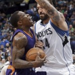 Minnesota Timberwolves' Nikola Pekovic, right, stops a drive by Phoenix Suns' Eric Bledsoe during the first quarter of an NBA basketball game, Friday, Feb. 20, 2015, in Minneapolis. (AP Photo/Jim Mone)