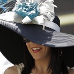 Jenny Paul wears a hat before the 141st running of the Kentucky Derby horse race at Churchill Downs Saturday, May 2, 2015, in Louisville, Ky. (AP Photo/David J. Phillip)