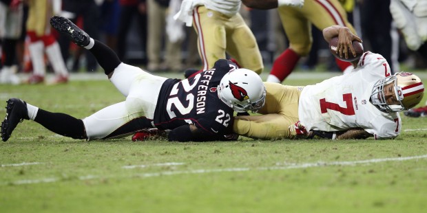 San Francisco 49ers quarterback Colin Kaepernick (7) is sacked by Arizona Cardinals free safety Ton...