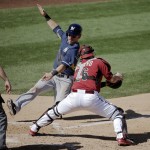 Milwaukee Brewers' Scooter Gennett, is tagged out by Arizona Diamondbacks catcher Miguel Montero while trying to score on a hit by Jonathan Lucroy during the fifth inning of a spring exhibition baseball game in Scottsdale, Ariz., Sunday, March 16, 2014. (AP Photo/Chris Carlson)