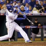 Kansas City Royals' Alcides Escobar hits an RBI double during the fifth inning of Game 6 of baseball's World Series against the San Francisco Giants Tuesday, Oct. 28, 2014, in Kansas City, Mo. (AP Photo/David J. Phillip)