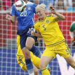 United States' Abby Wambach (20) and Sweden's Nilla Fischer (5) vie for the ball during second-half FIFA Women's World Cup soccer game action in Winnipeg, Manitoba, Canada, Friday, June 12, 2015.
