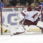 Arizona Coyotes goalie Mike Smith (41) watches New York Rangers' Martin St. Louis (26) during the first period of an NHL hockey game Thursday, Feb. 26, 2015, in New York. (AP Photo/Frank Franklin II)