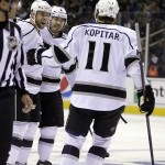 Los Angeles Kings' Jake Muzzin, left, celebrates with Anze Kopitar (11) after Muzzin scored against the San Jose Sharks during the first period of Game 2 of an NHL hockey first-round playoff series Sunday, April 20, 2014, in San Jose, Calif. (AP Photo/Ben Margot)