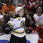 Boston Bruins left wing Jordan Caron (38) celebrates his goal during the first period of Game 3 of a first-round NHL hockey playoff series against the Detroit Red Wings in Detroit, Tuesday, April 22, 2014. (AP Photo/Carlos Osorio)