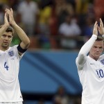  England's Steven Gerrard, left, and Wayne Rooney applaud spectators after the group D World Cup soccer match between England and Italy at the Arena da Amazonia in Manaus, Brazil, Saturday, June 14, 2014. Italy won the match 2-1. (AP Photo/Martin Mejia)