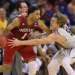 Indiana's James Blackmon Jr. (1) is defended by Wichita State's Ron Baker (31) during the first half of an NCAA tournament college basketball game in the Round of 64 in Omaha, Neb., Friday, March 20, 2015. (AP Photo/Nati Harnik)