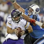 Minnesota Vikings quarterback Christian Ponder (7) is hit by Tennessee Titans defensive end Karl Klug, right, as Ponder is sacked for a 6-yard loss in the second quarter of a preseason NFL football game Thursday, Aug. 28, 2014, in Nashville, Tenn. (AP Photo/Wade Payne)