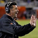 Oklahoma State coach Mike Gundy signals during the second half of the Cactus Bowl NCAA college football game against Washington, Friday, Jan. 2, 2015, in Tempe, Ariz. (AP Photo/Matt York)