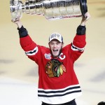 Chicago Blackhawks' Jonathan Toews hoists the Stanley Cup after defeating the Tampa Bay Lightning in Game 6 of the NHL hockey Stanley Cup Final series on Wednesday, June 10, 2015, in Chicago. The Blackhawks defeated the Lightning 2-0 to win the series 4-2. (AP Photo/Charles Rex Arbogast)