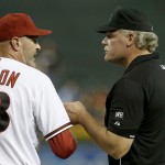 Arizona Diamondbacks' Kirk Gibson (23) is ejected from the game by umpire Ted Barrett after a Gibson argued a play that was already reviewed during the ninth inning of a baseball game against the Milwaukee Brewers on Monday, June 16, 2014, in Phoenix. The Brewers defeated the Diamondbacks 9-3. (AP Photo/Ross D. Franklin)