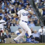  Los Angeles Dodgers' Andre Ethier, right, watches the flight of his three-run home run during the fourth inning of a baseball game against the Arizona Diamondbacks, Saturday, April 19, 2014, in Los Angeles. (AP Photo/Jae C. Hong)