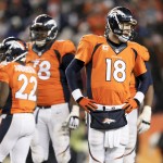 Denver Broncos quarterback Peyton Manning, right, looks to the bench after failing to convert on fourth down against the Indianapolis Colts during the second half of an NFL divisional playoff football game, Sunday, Jan. 11, 2015, in Denver. (AP Photo/Joe Mahoney)
