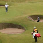 Charl Schwartzel of South Africa plays out of a bunker on the 18th green during the third day of the British Open Golf championship at the Royal Liverpool golf club, Hoylake, England, Saturday July 19, 2014. (AP Photo/Peter Morrison)