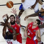 United States' James Harden, left, and United States' DeMarcus Cousins, right, and Serbia's Nemanja Bjelica, 2nd right, and Serbia's Rasko Katic vie for the ball during the final World Basketball match between the United States and Serbia at the Palacio de los Deportes stadium in Madrid, Spain, Sunday, Sept. 14, 2014. (AP Photo/Manu Fernandez)