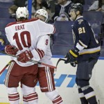 Arizona Coyotes' Sam Gagner (9) celebrates with teammate Martin Erat (10), as St. Louis Blues' Patrik Berglund (21) skates by, after he scored a goal in the first period of an NHL hockey game, Tuesday, Feb. 10, 2015, in St. Louis. (AP Photo/Tom Gannam)