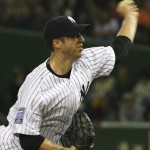 MLB All-Stars starter Chris Capuano delivers a pitch against Japan in the first inning of Game 4 of their exhibition baseball series at Tokyo Dome, in Tokyo, Sunday, Nov. 16, 2014. (AP Photo/Toru Takahashi)