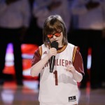 Marlana VanHoose performs the national anthem before the start of Game 6 of basketball's NBA Finals between the Cleveland Cavaliers and the Golden State Warriors in Cleveland, Tuesday, June 16, 2015. (AP Photo/Tony Dejak)
