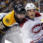  Boston Bruins defenseman Johnny Boychuk (55) checks Montreal Canadiens right wing Dale Weise (22) during the first period in Game 1 of an NHL hockey second-round playoff series in Boston, Thursday, May 1, 2014. (AP Photo/Elise Amendola)