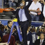 Connecticut head coach Kevin Ollie cuts down the net after beating Kentucky 60-54, at the NCAA Final Four tournament college basketball championship game Monday, April 7, 2014, in Arlington, Texas. (AP Photo/Tony Gutierrez)