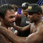 Manny Pacquiao, from the Philippines, left, and Floyd Mayweather Jr., embrace in the ring at the finish of their welterweight title fight on Saturday, May 2, 2015 in Las Vegas. (AP Photo/Isaac Brekken)
