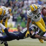 Green Bay Packers' Randall Cobb (18) is tackled by Seattle Seahawks' Earl Thomas (29) during the first half of the NFL football NFC Championship game Sunday, Jan. 18, 2015, in Seattle. (AP Photo/Ted S. Warren)