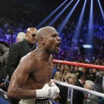 Floyd Mayweather Jr., celebrates his unanimous decision victory over Manny Pacquiao, from the Philippines, at the finish of their welterweight title fight on Saturday, May 2, 2015 in Las Vegas. (AP Photo/Isaac Brekken)