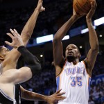  Oklahoma City Thunder forward Kevin Durant (35) shoots in front of San Antonio Spurs forward Tim Duncan and center in the first quarter of Game 4 of the Western Conference finals NBA basketball playoff series in Oklahoma City, Tuesday, May 27, 2014. (AP Photo/Sue Ogrocki)