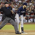  Umpire Ted Barrett, left, throws Arizona Diamondbacks pitcher Evan Marshall out of the game for hitting Milwaukee Brewers' Ryan Braun, right, during the seventh inning of a baseball game on Tuesday, June 17, 2014, in Phoenix. (AP Photo/Ross D. Franklin)