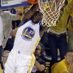 Golden State Warriors forward Draymond Green (23) dunks against the Cleveland Cavaliers during the first half of Game 5 of basketball's NBA Finals in Oakland, Calif., Sunday, June 14, 2015. (AP Photo/Eric Risberg)
