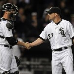  Chicago White Sox closing pitcher Matt Lindstrom (27), celebrates with catcher Tyler Flowers left, after defeating the Arizona Diamondbacks 9-3 in a baseball game in Chicago, Friday, May 9, 2014. (AP Photo/Paul Beaty)