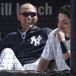  New York Yankees Derek Jeter, left, enjoying a rare day off, chats with New York Yankees Jacoby Ellsbury, during the eighth inning of a baseball game against the Texas Rangers at Yankee Stadium in New York, Thursday, July 24, 2014. The Yankees defeated the Texas Rangers 4-2. (AP Photo)
